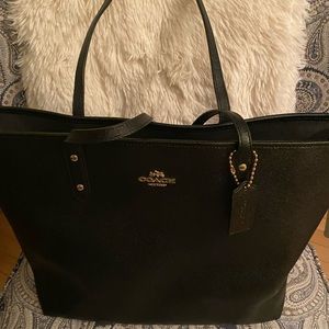 Large black leather coach bag only a few years old only use it twice.